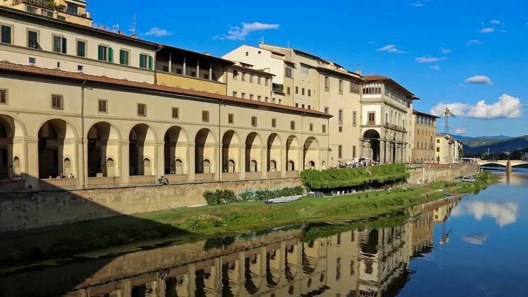 Uffizi Gallery exterior along the Arno River, Florence, Italy, part of guided tour.