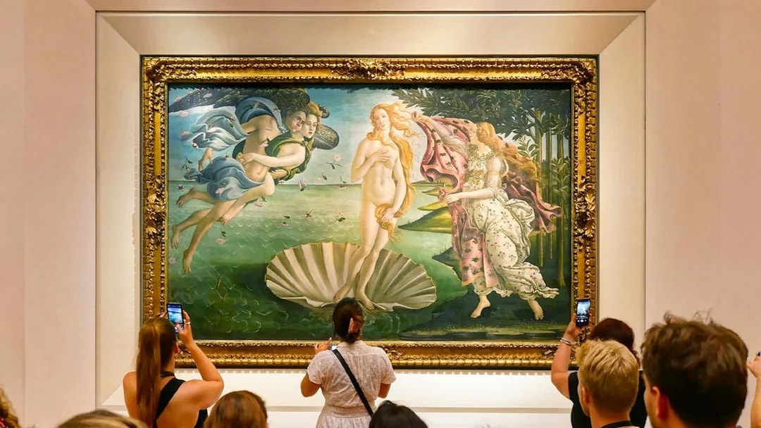 Tourists viewing Botticelli's "The Birth of Venus" at Uffizi Gallery, Florence.