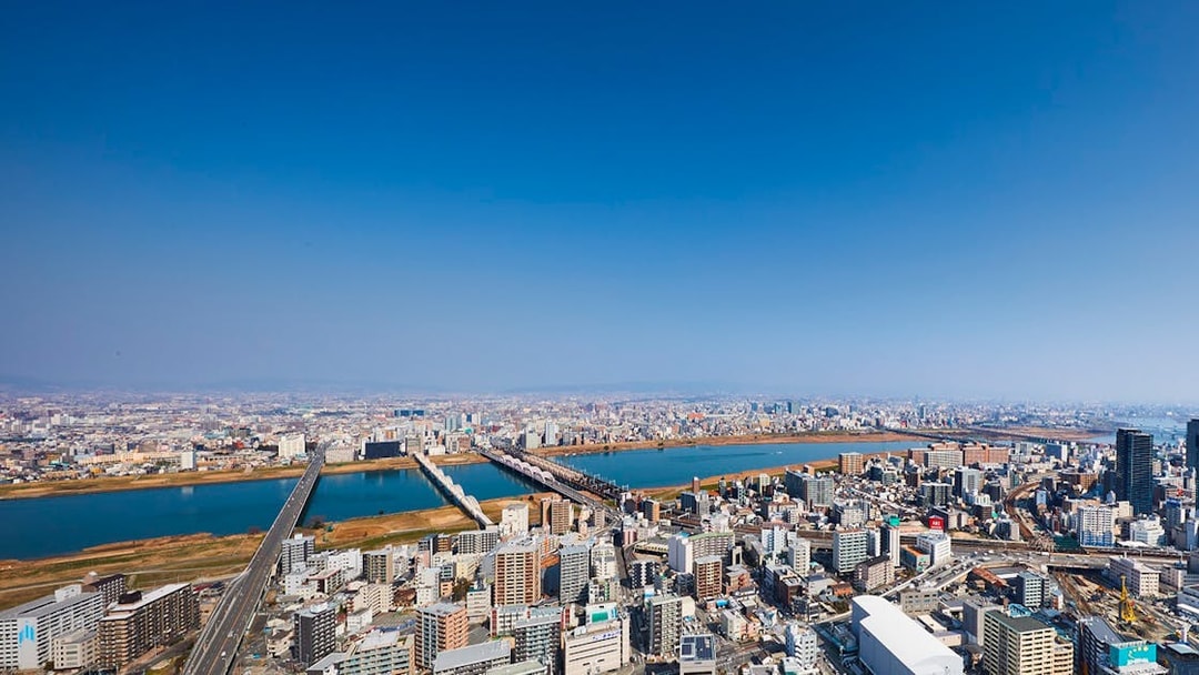 Aerial view of Osaka cityscape with Yodo River, seen from Umeda Sky Building.
