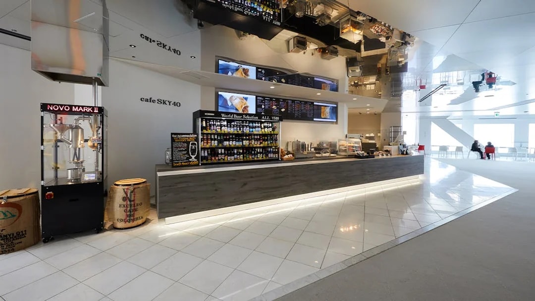 Cafe Sky 40 counter with beverage selection at Umeda Sky Building, Osaka.