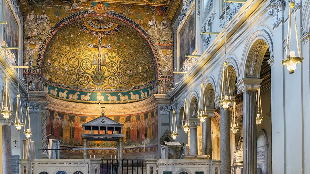 San Clemente Basilica's ornate apse mosaic in Rome, featuring religious iconography.