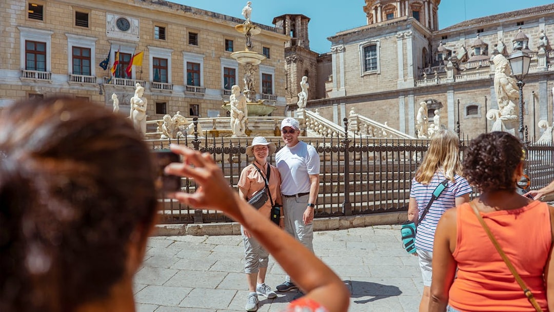 Tourists at Fontana Pretoria, Palermo during UNESCO Sites Walking Tour.