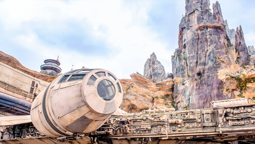 Spaceship attraction at Universal Studios Resort, Orlando, Florida with rocky landscape.