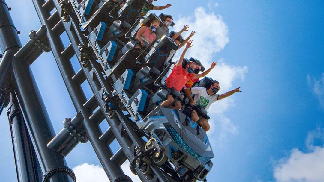 People riding Velocicoaster at Universal Orlando's Jurassic Park.