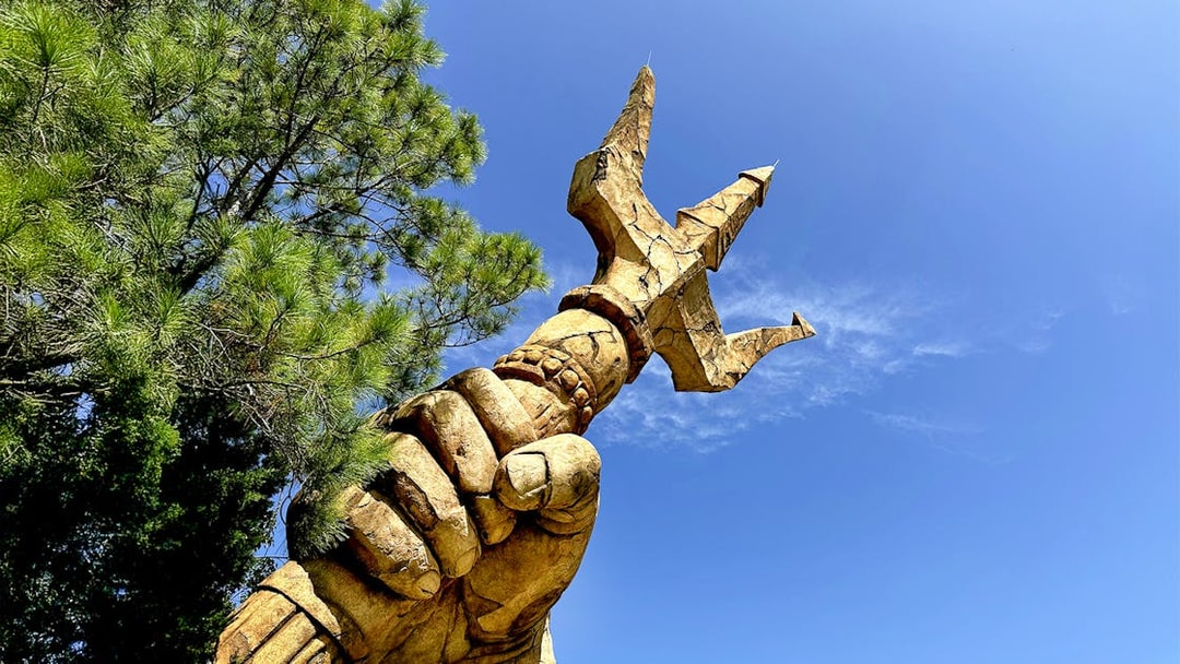Trident held by a statue's hand at The Lost Continent, Islands of Adventure, Universal Orlando.