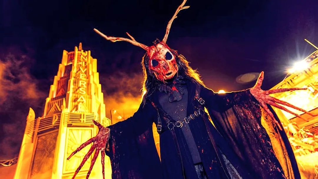 Halloween character with antlers at Universal Studios Hollywood entrance during Halloween Horror Nights.