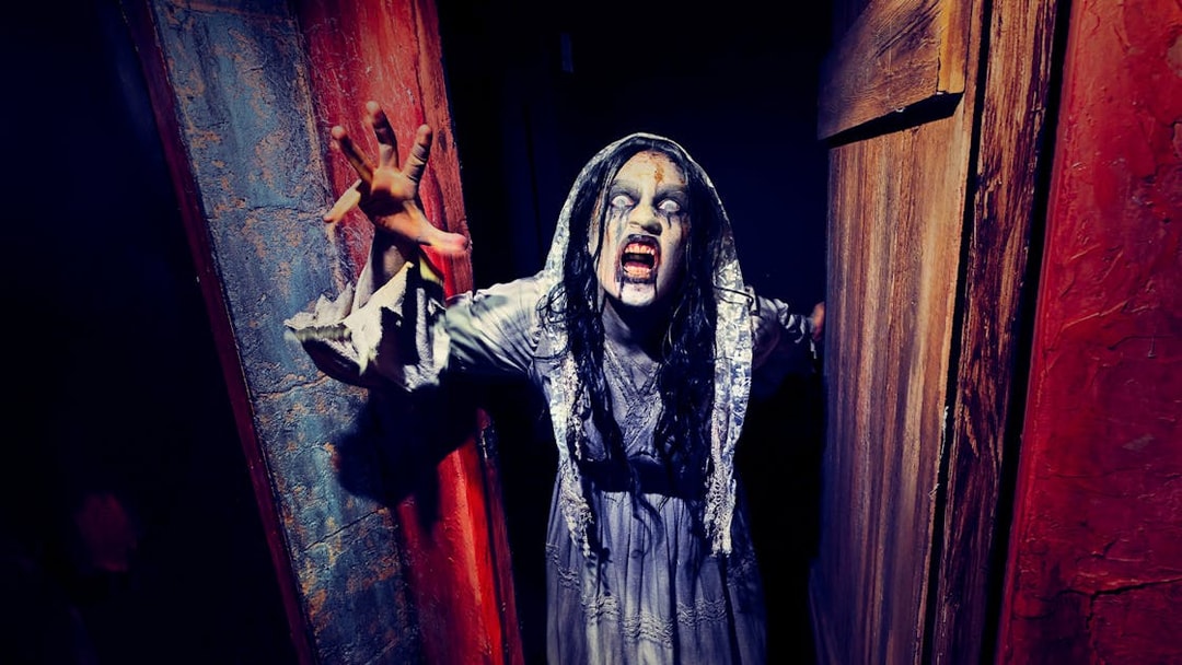 Ghost bride reaching out at Hollywood Horror Nights, Universal Studios Hollywood, Los Angeles.