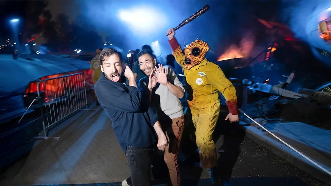 Guests reacting to a costumed performer at Hollywood Horror Nights, Universal Studios Hollywood, Los Angeles.