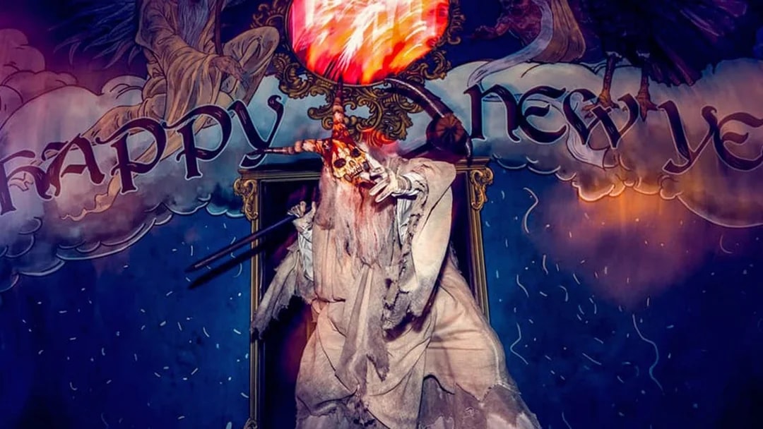 Ghostly figure with a skull staff at Universal Studios Hollywood Halloween Horror Nights.