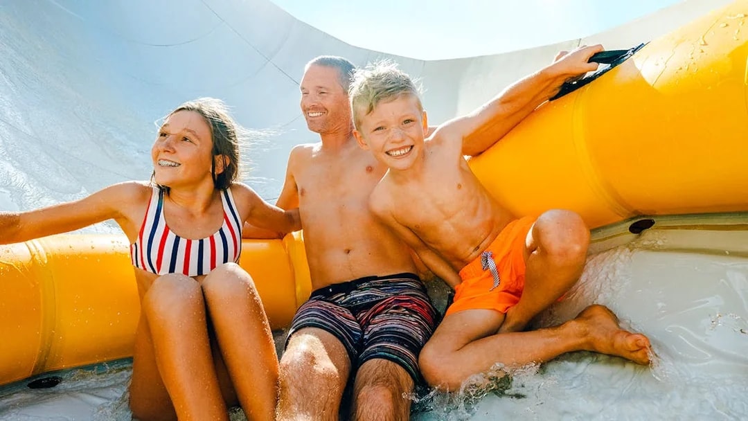 Family enjoying Mammoth Falls ride at Wet n Wild, Gold Coast.