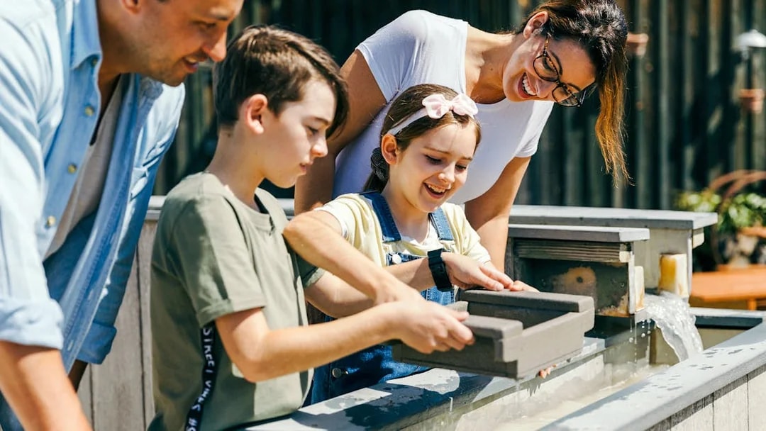 Children panning for gold at Paradise Country, Gold Coast.