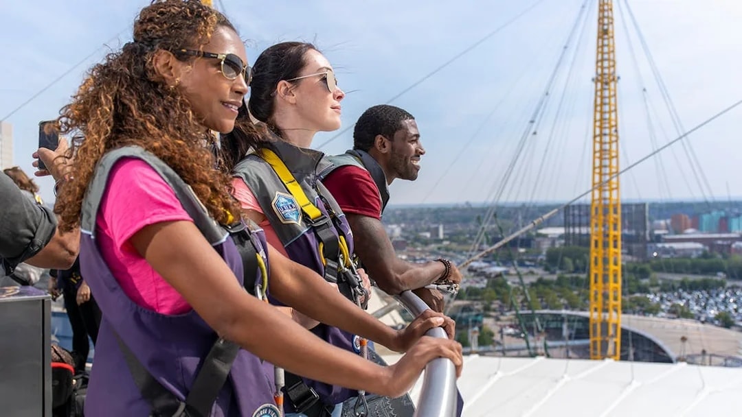 Guests enjoying the view from the O2 rooftop in London during daytime.