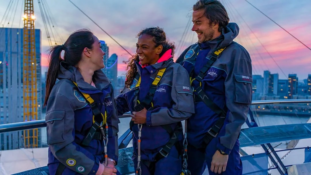 Guests enjoying a climb at the O2 in London during twilight.