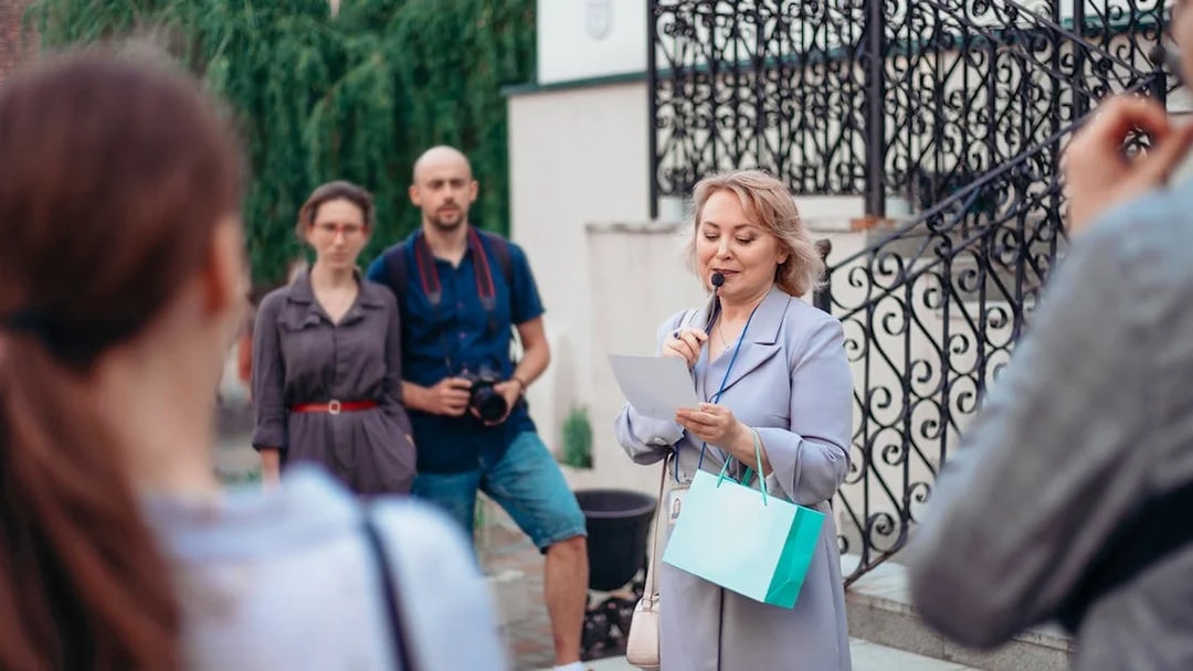 Tour guide speaking to a small group at Upper Belvedere Palace.