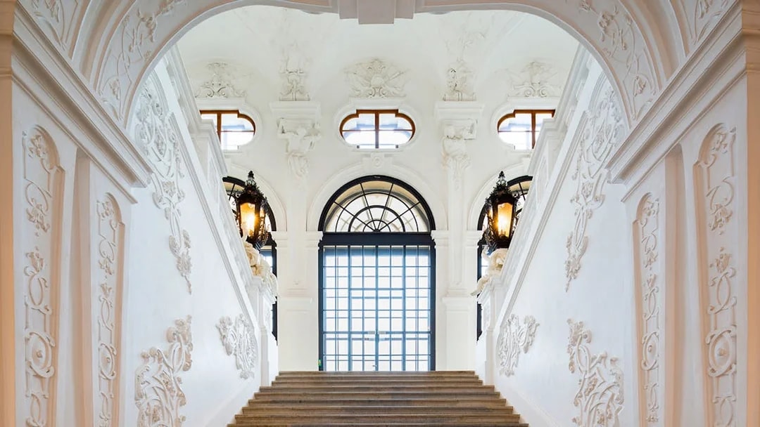Staircase with ornate carvings at Belvedere Palace, Vienna.