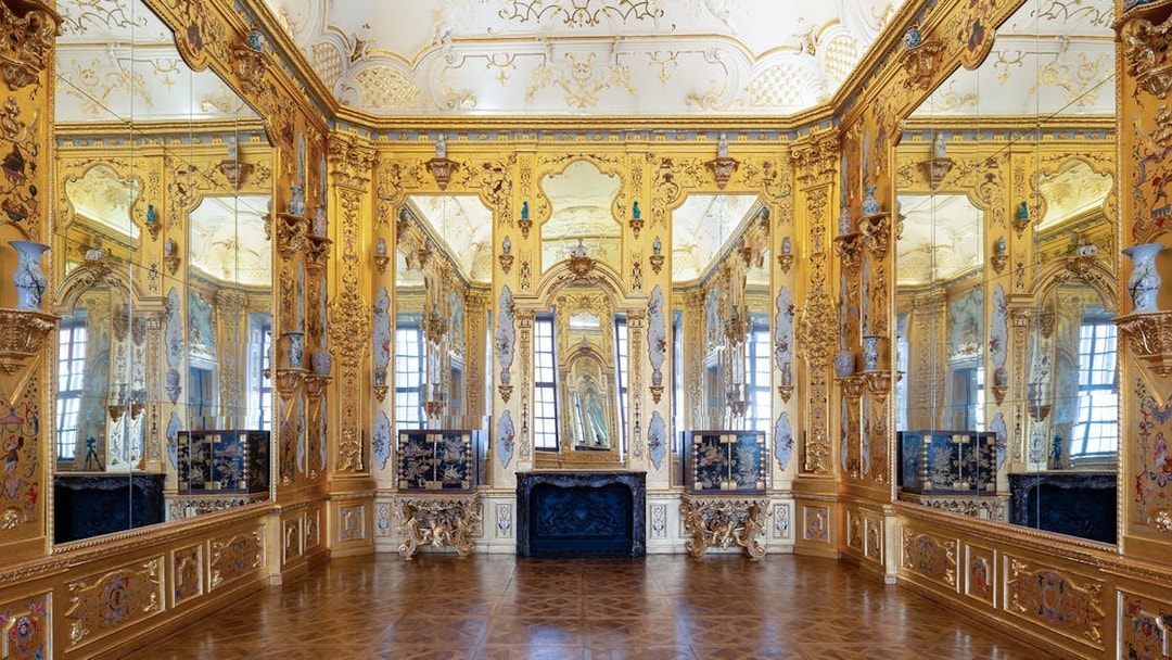 Ornate gold room interior at Upper Belvedere Palace, Vienna.
