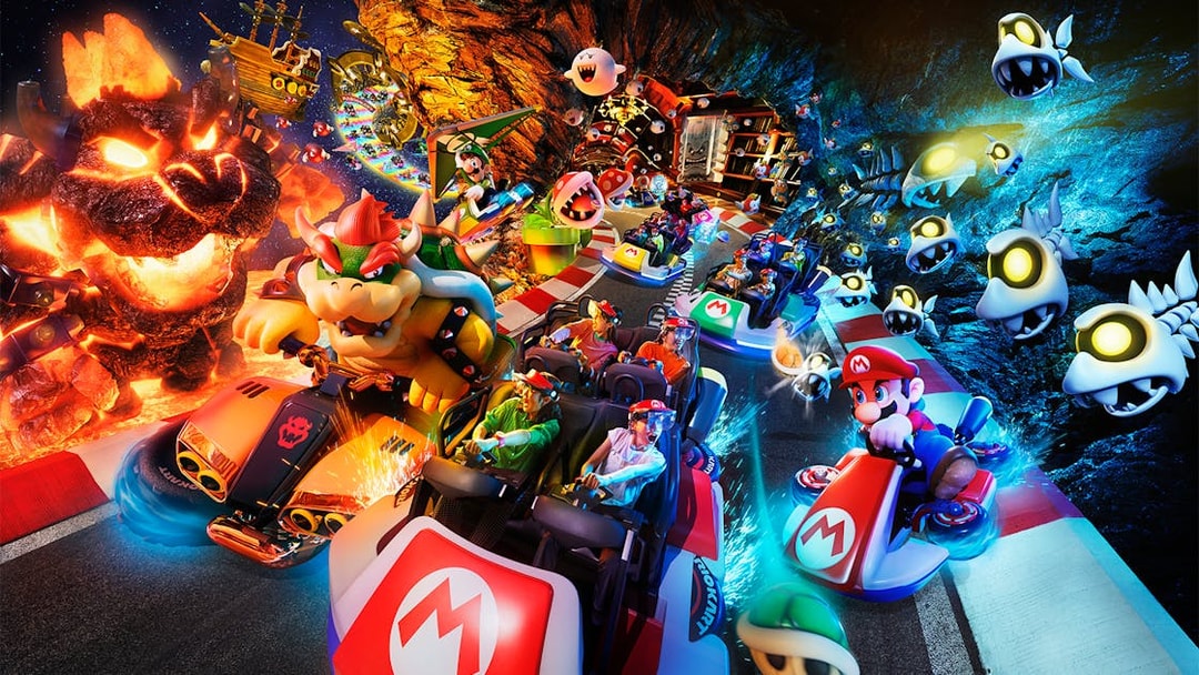 Mario Kart ride with characters at Universal Studios Japan, featuring Bowser and Mario racing.