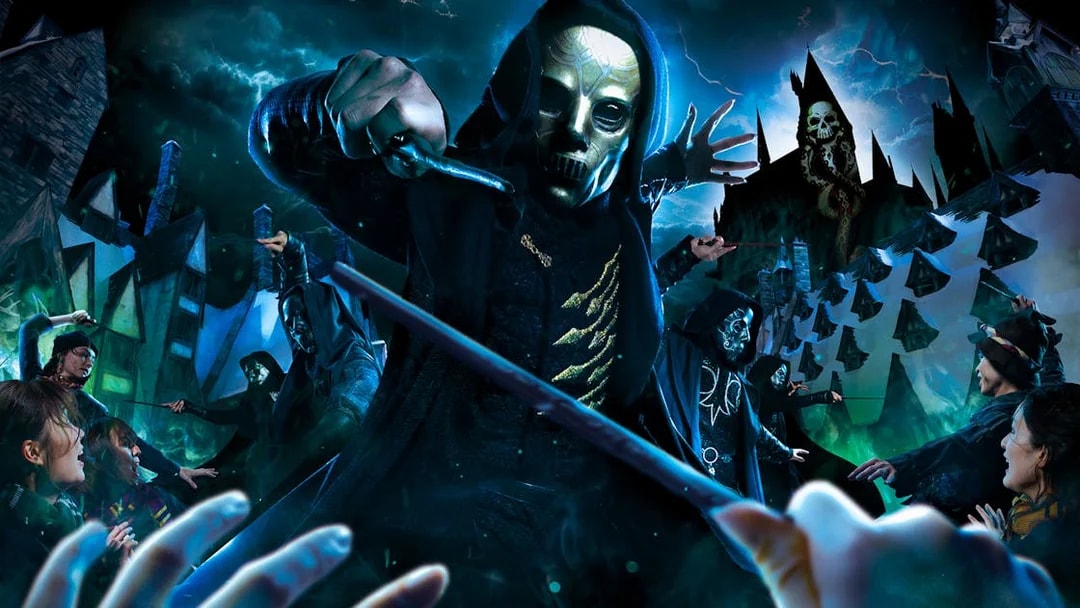 Masked figures with wands in a magical battle scene at a theme park attraction.