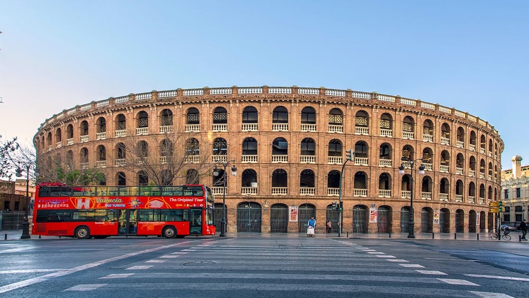 Valencia tour bus in front of Plaza de Toros, Spain.