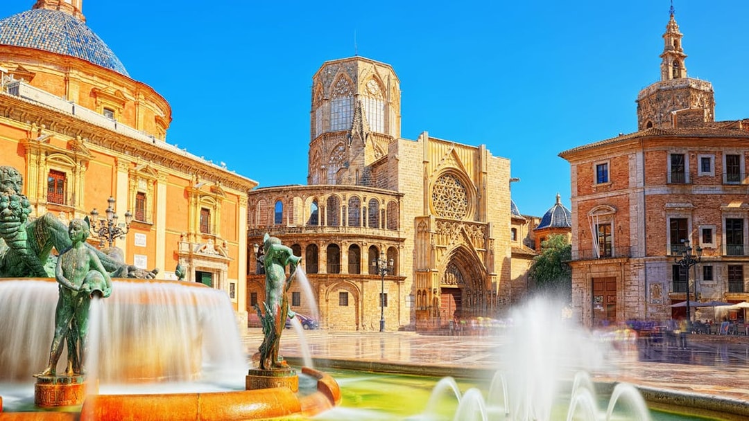 Valencia Cathedral and Turia Fountain on a sunny day during a self-guided audio tour.