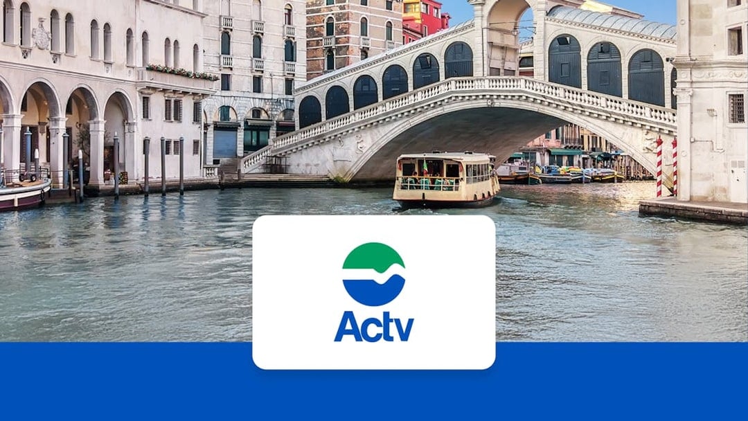 Venice ACTV water taxi near Rialto Bridge on the Grand Canal.