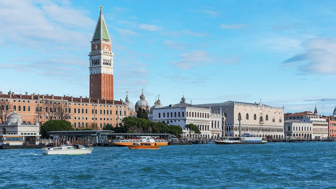 San Marco Venice view from a boat with St. Mark's Campanile and Doge's Palace.