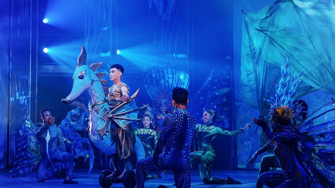 Performers in aquatic costumes during Varuna, Underwater Theatrical Dining Experience.