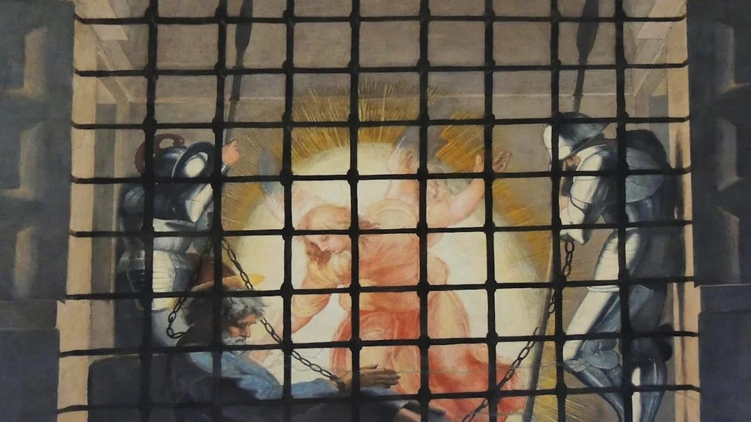 Angel appearing to chained prisoner in Vatican Museums fresco.
