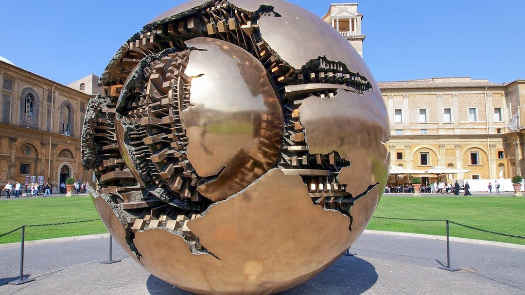 Sculpture of a bronze sphere in the Vatican Museums courtyard, Rome.