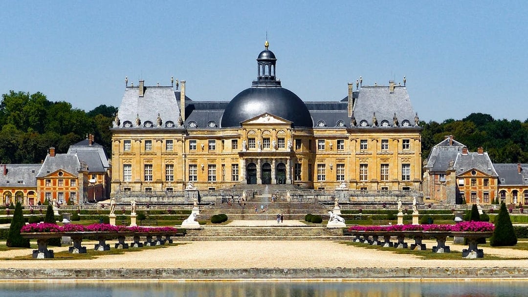 Château of Vaux-le-Vicomte with gardens and reflecting pool in France.
