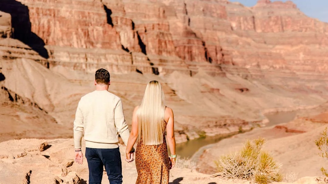 Guests walking at Grand Canyon West Rim during helicopter tour floor landing.
