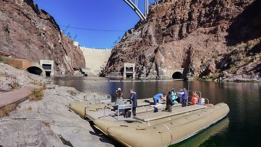 Rafting tour at Black Canyon near Hoover Dam, with tourists boarding the raft.