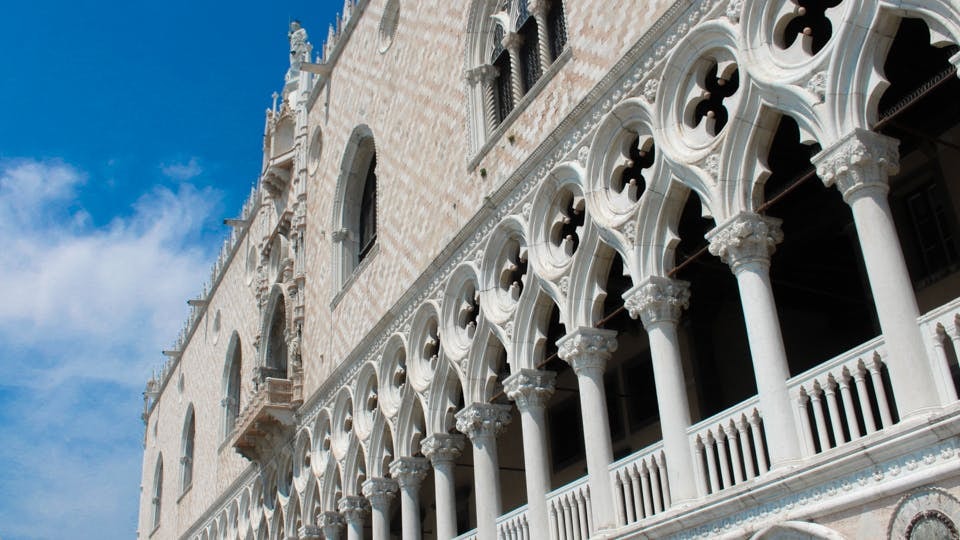 Doge’s Palace facade with Gothic arches in Venice, part of 3-Museum Pass tour.