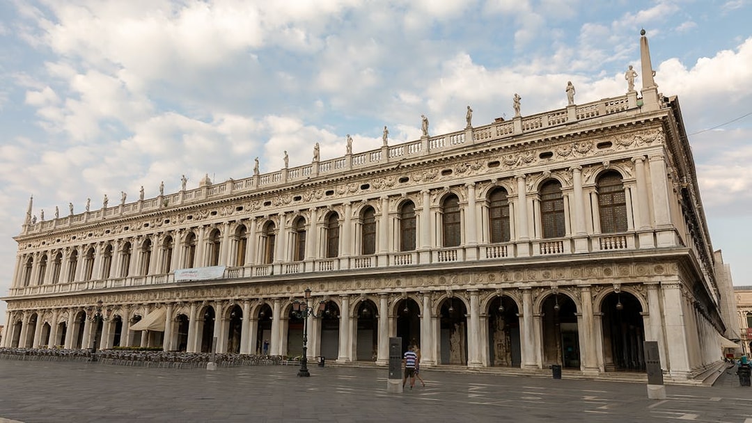 Correr Museum facade in Venice with ornate architecture and statues.
