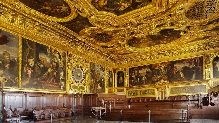 Doge’s Palace ornate hall with gilded ceiling and historic paintings, Venice.
