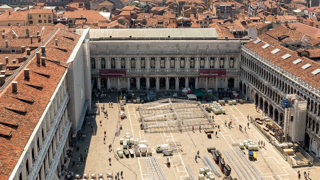 Aerial view of Correr Museum in Venice with people walking in the courtyard.