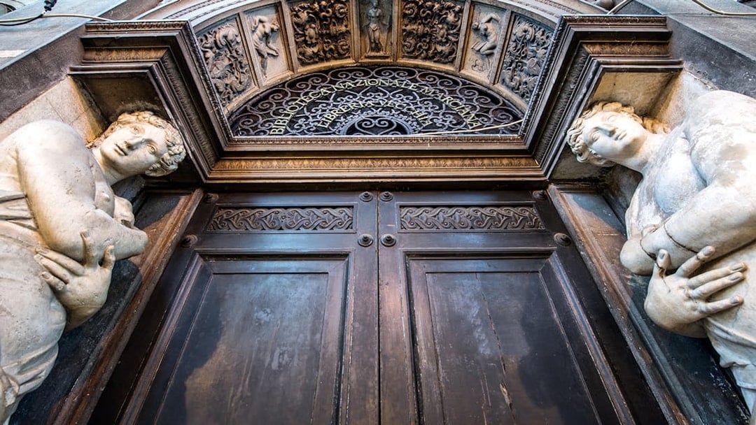 Ornate entrance with sculptures at Doge's Palace, Venice, part of 3 Museum Pass tour.