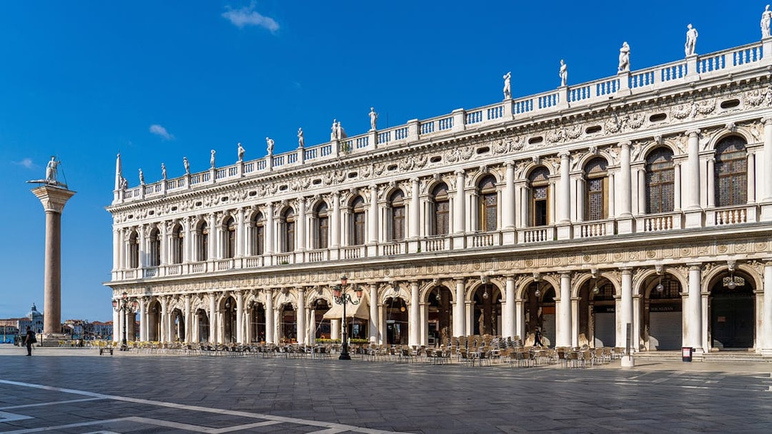 Marciana Library facade in Renaissance style, Venice, with statues and columns.