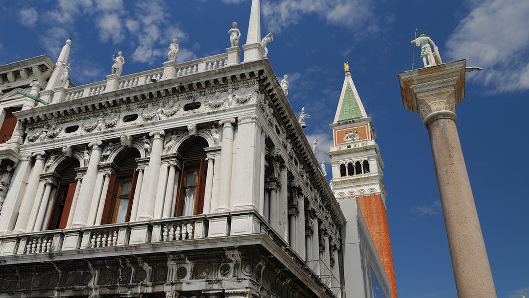 Marciana Library facade with St Theodore on a pillar in St Mark's Piazzetta, Venice.
