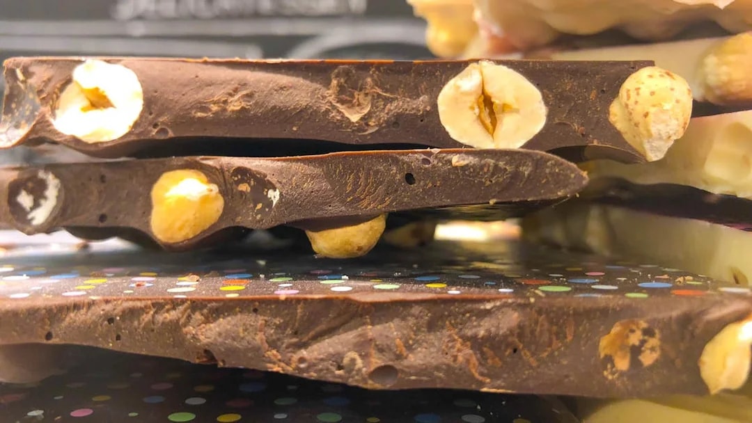 Stacked chocolate bars with hazelnuts, part of a chocolate tasting in Venice.