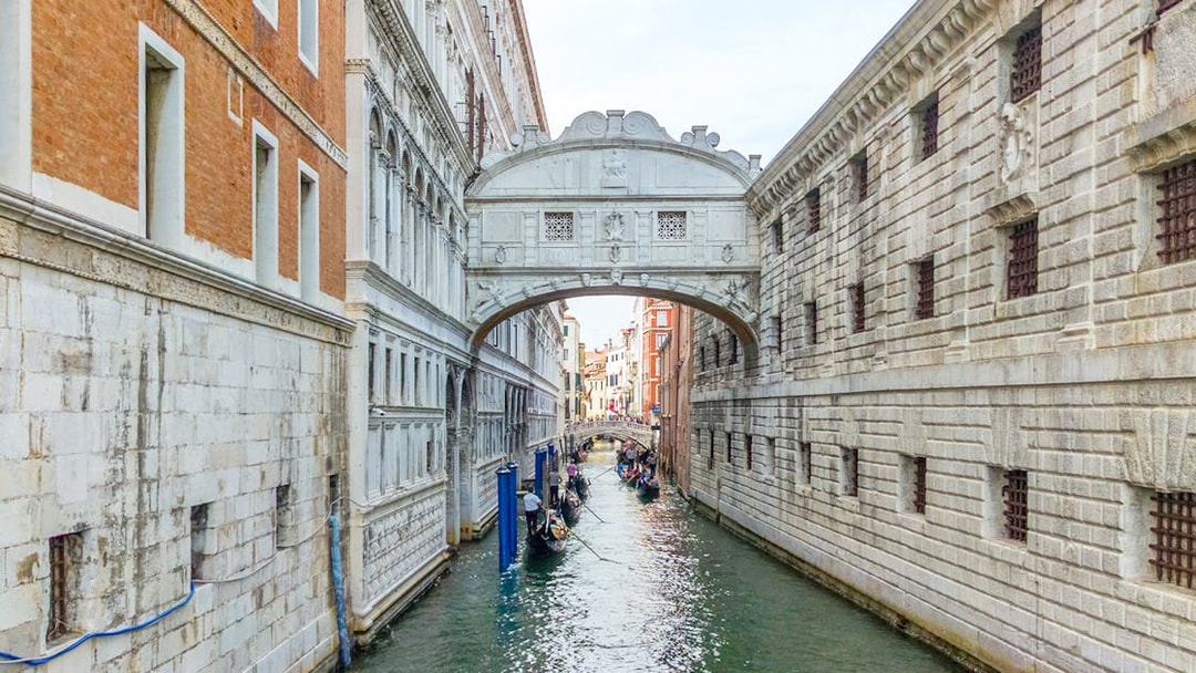 Gondolas passing under the Bridge of Sighs in Venice, Italy.