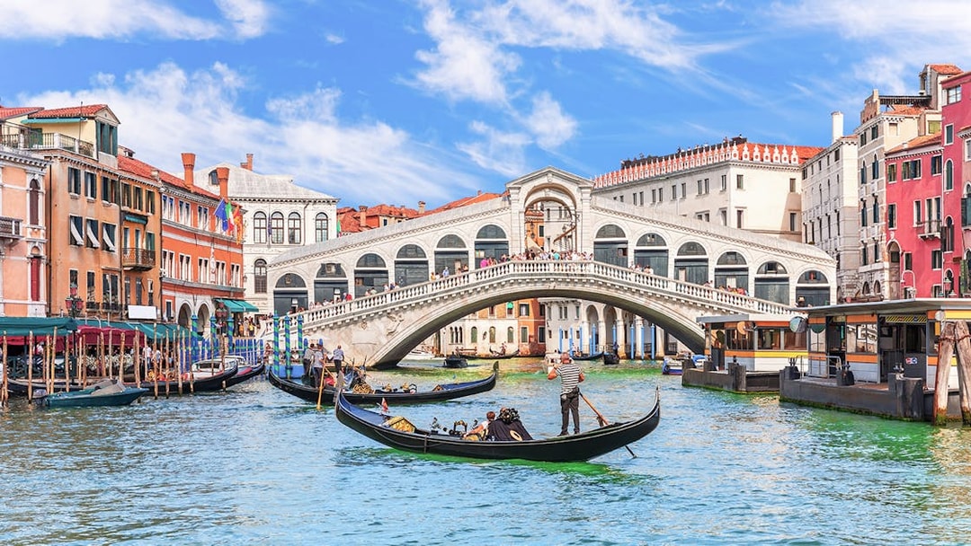 Gondolas on the Grand Canal near the Rialto Bridge in Venice.
