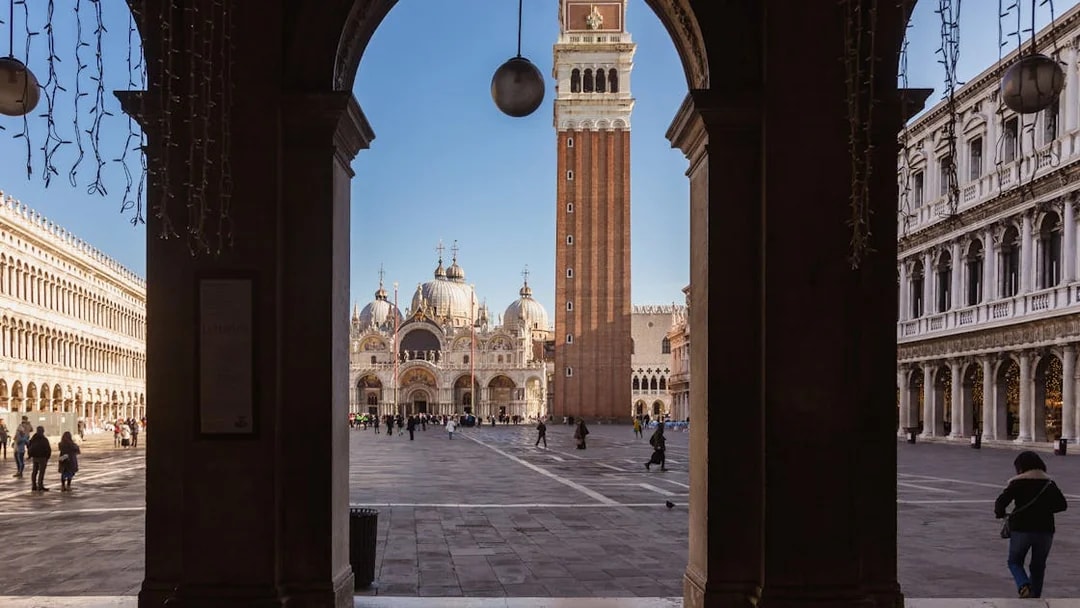 St. Mark's Basilica and Campanile viewed from an archway in Venice.