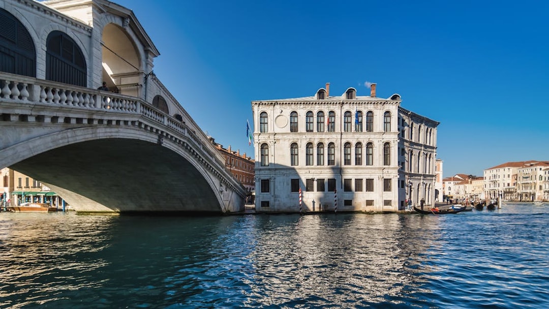 Rialto Bridge and canal view on a gondola ride in Venice.