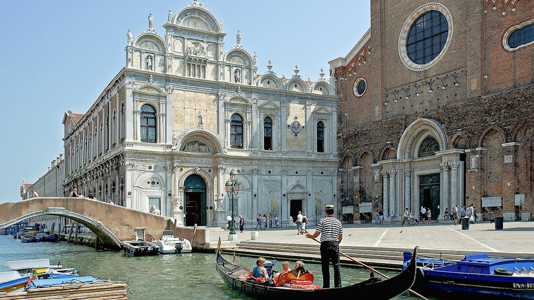 Gondola ride near Scuola Grande di San Marco, Venice, on a full-day guided tour.