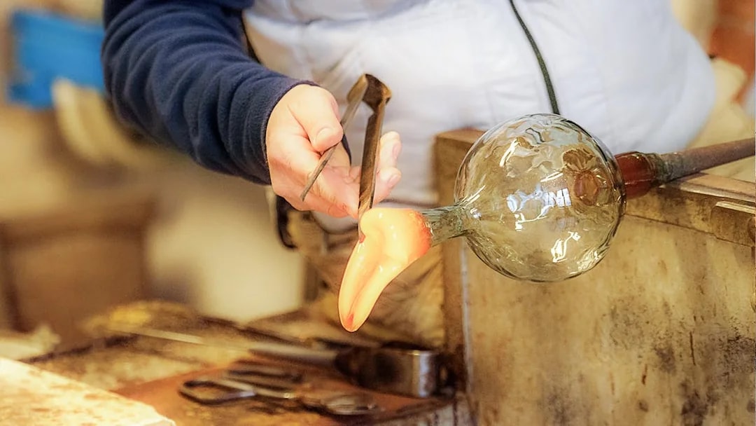 Glassblowing demonstration in Venice during full-day guided tour.