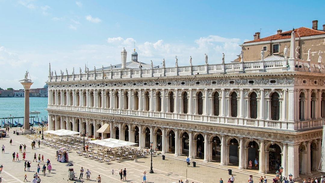Doge's Palace in Venice with tourists in the courtyard, part of the Venice Museums Pass.