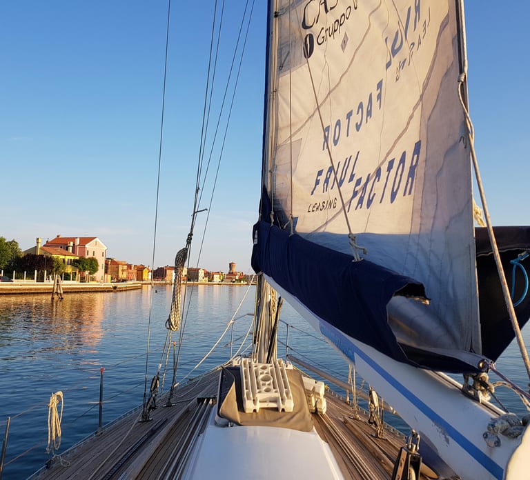 Venice by sailboat between Murano, the Lido, and the mysterious islands