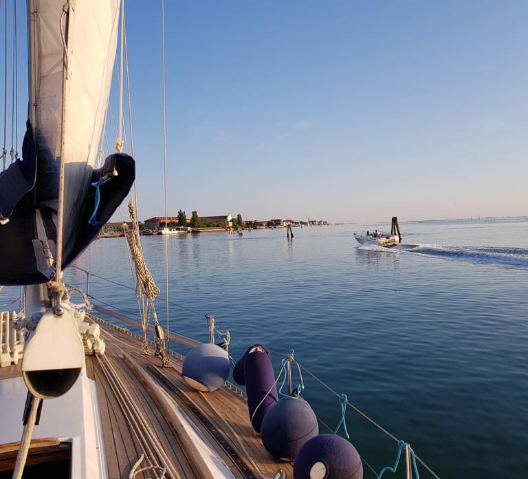 Venice by sailboat between Murano, the Lido, and the mysterious islands