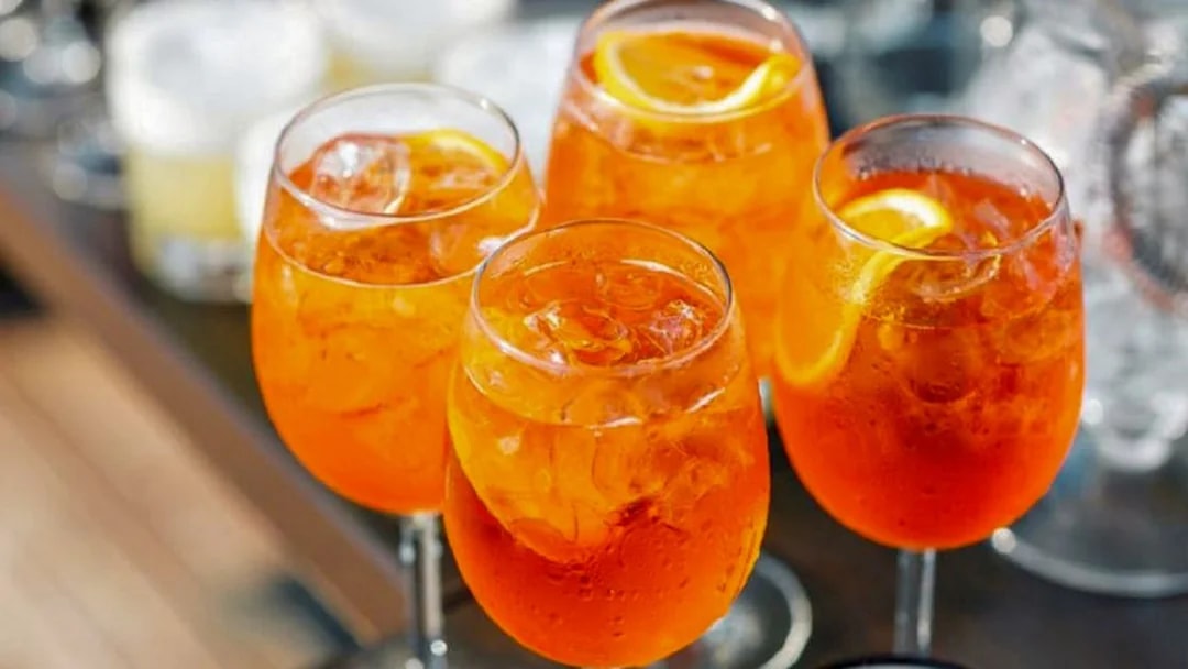 Cocktails with orange slices at Venice's Royal Garden tour.